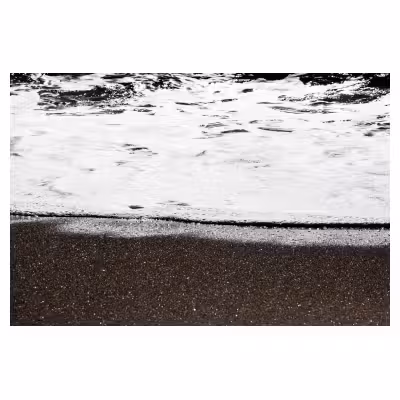 photographie de vagues échouant sur le sable